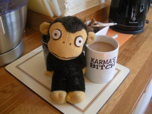 Carmen drinks out of a Karma's Bitch mug!